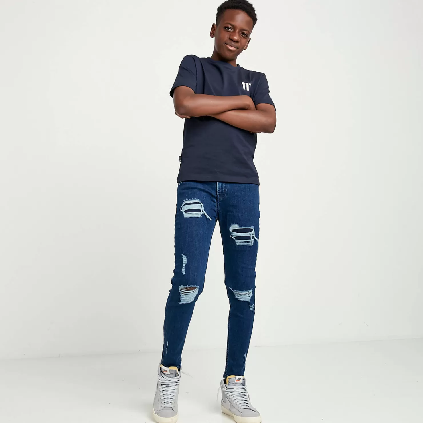 11 Degrees Jeans< Junior Sustainable Distressed Skinny Jeans – Mid Blue Wash